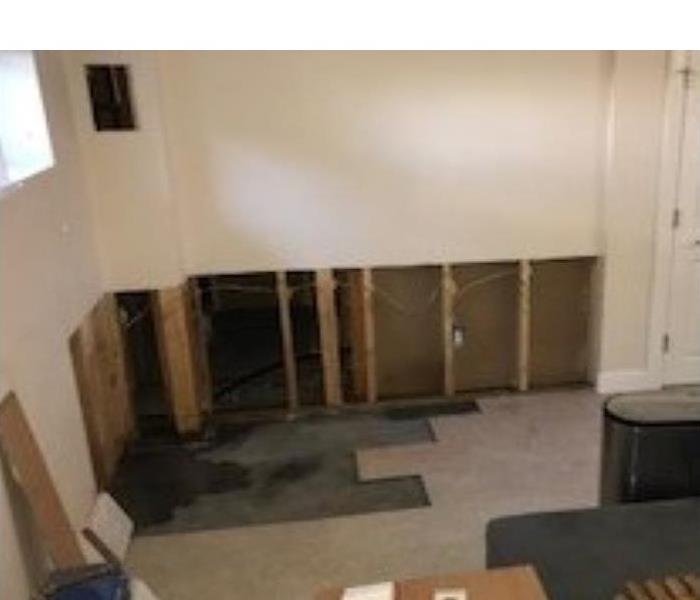 Room with walls being removed in a corner