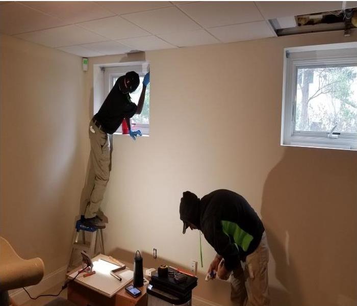 SERVPRO®  technicians painting a room
